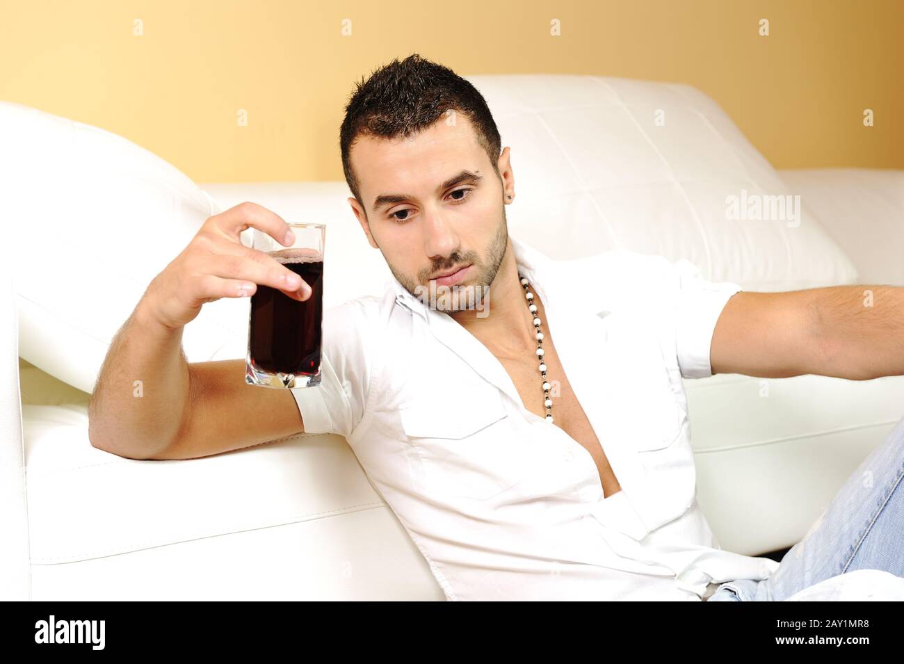 Young man drinking Stock Photo