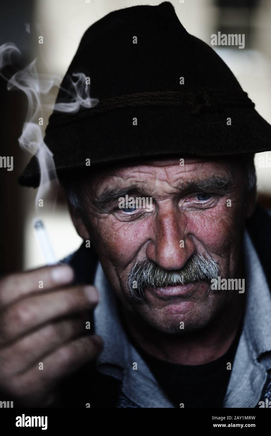 old person smoking cigarette 15,969 Senior Royalty-Free Images, Stock Photos & Pictures a old man smoking Stock