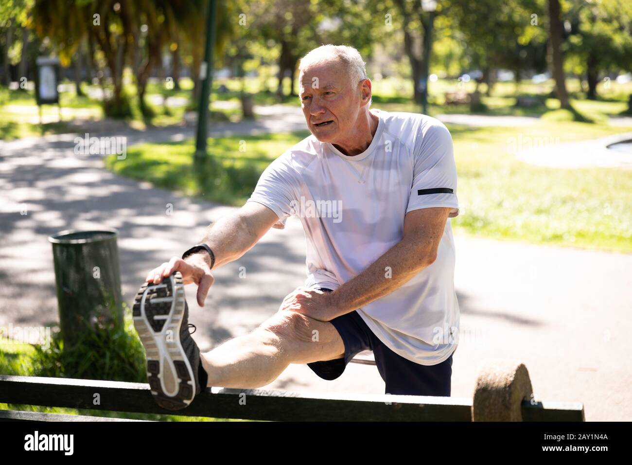 Jogger stretching in the park Stock Photo