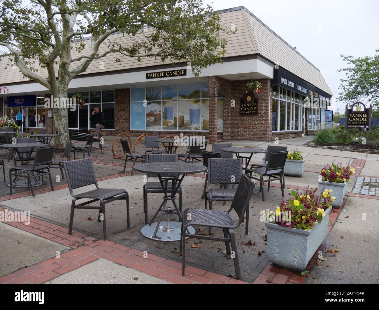 Newport, Rhode Island-September 2017: Outside dining tables and chairs at Yankee Candle in Newport. Stock Photo