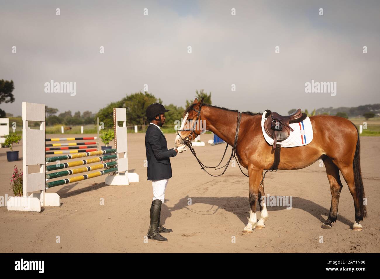 Man with his horse before dressage horse jumping event Stock Photo
