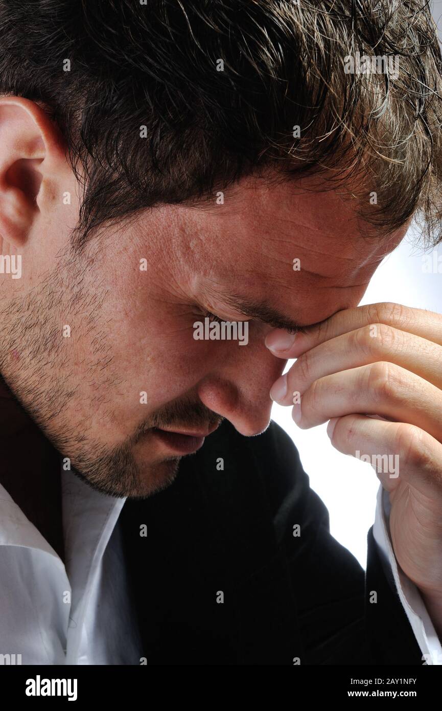 Young man having headache Stock Photo