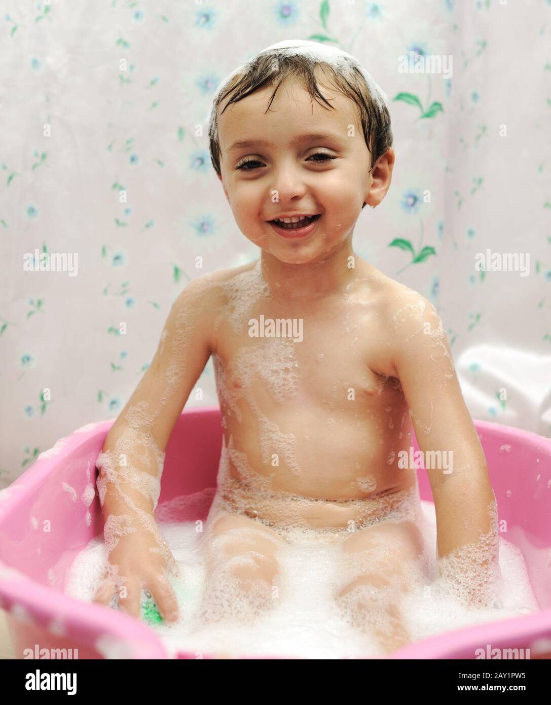Adorable boy taking a bath with soap suds on hair Stock Photo Alamy