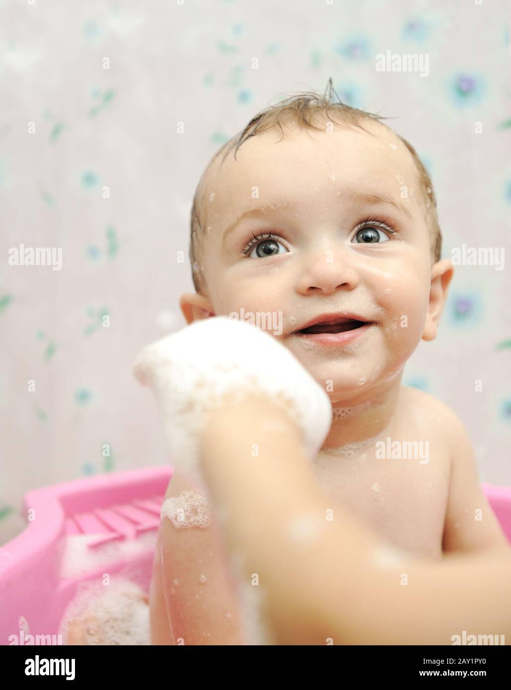 Adorable baby boy taking a bath with soap suds on hair Stock Photo Alamy
