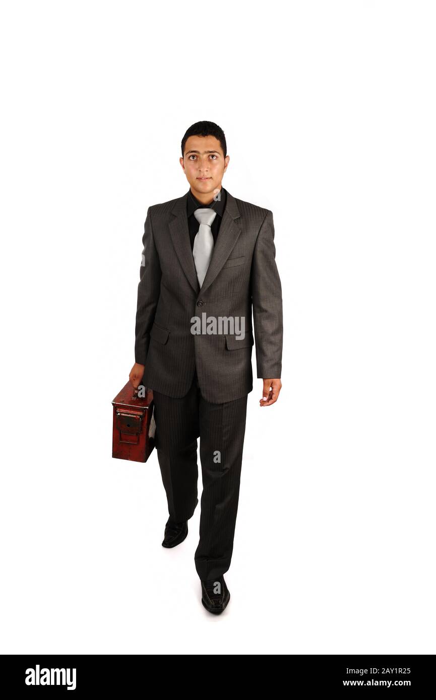 Businessman holding an old briefcase Stock Photo