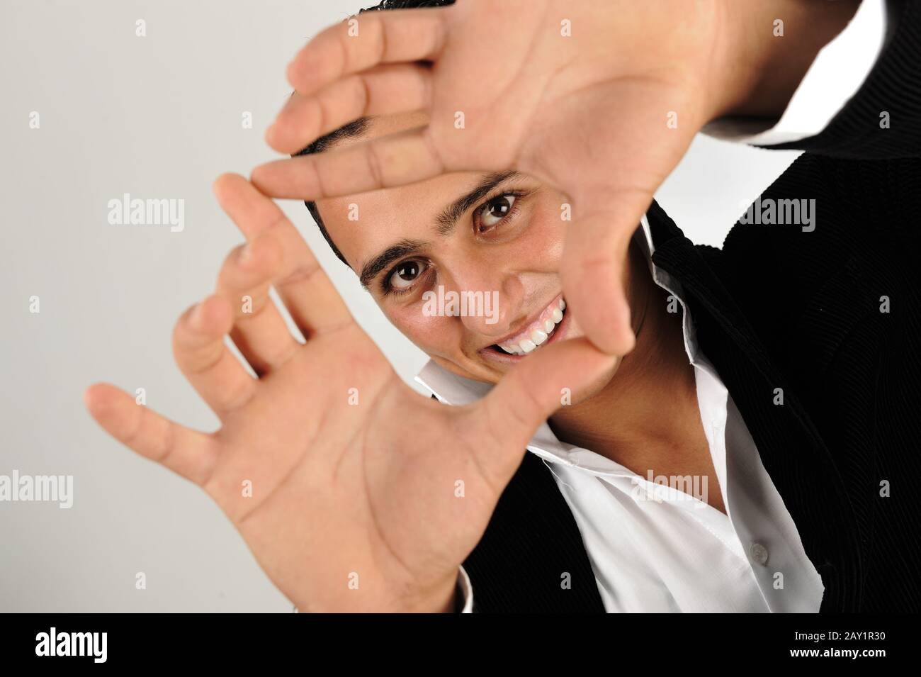 Young man making shape with his hands Stock Photo