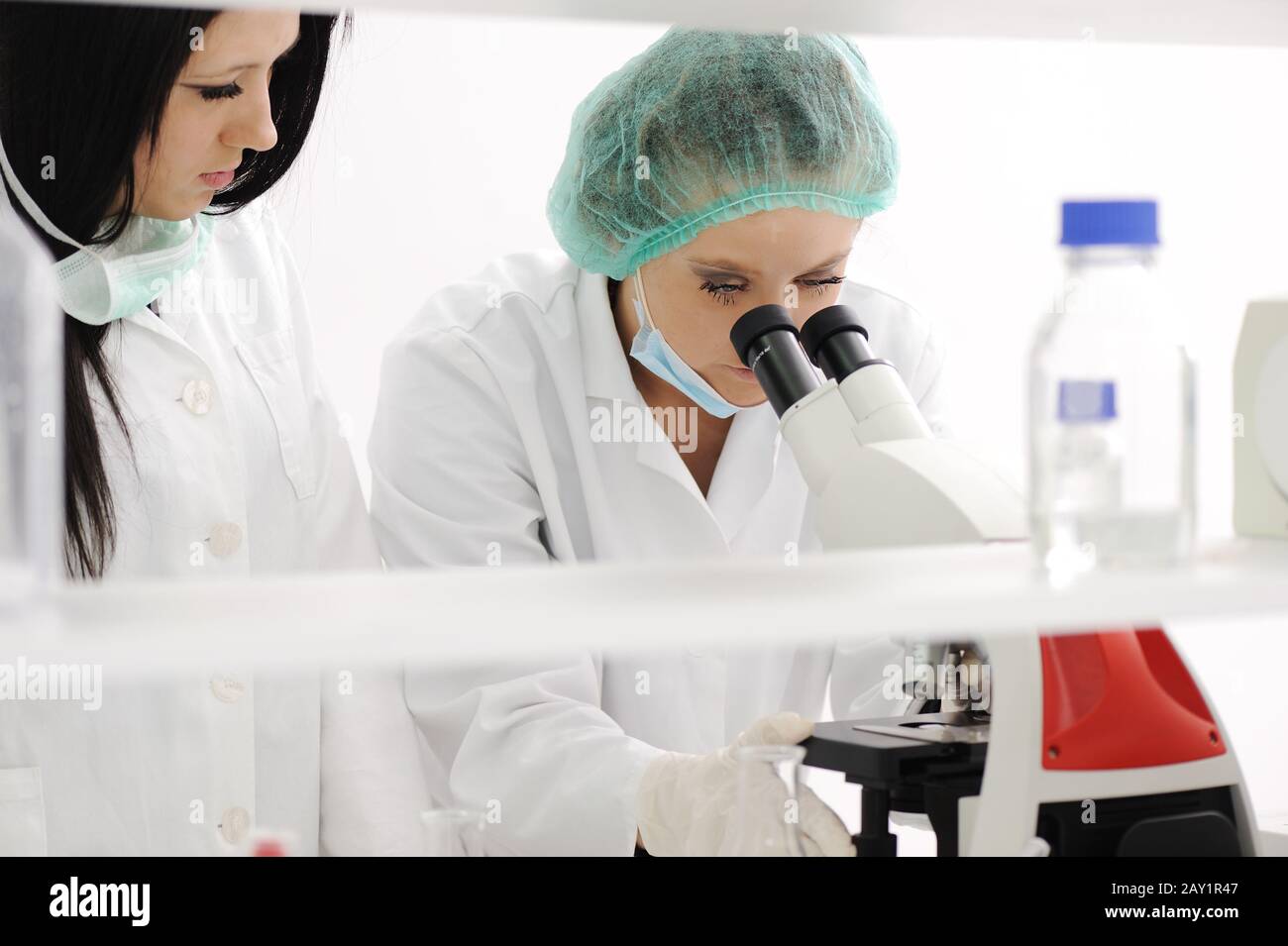 Working in lab with microscope Stock Photo