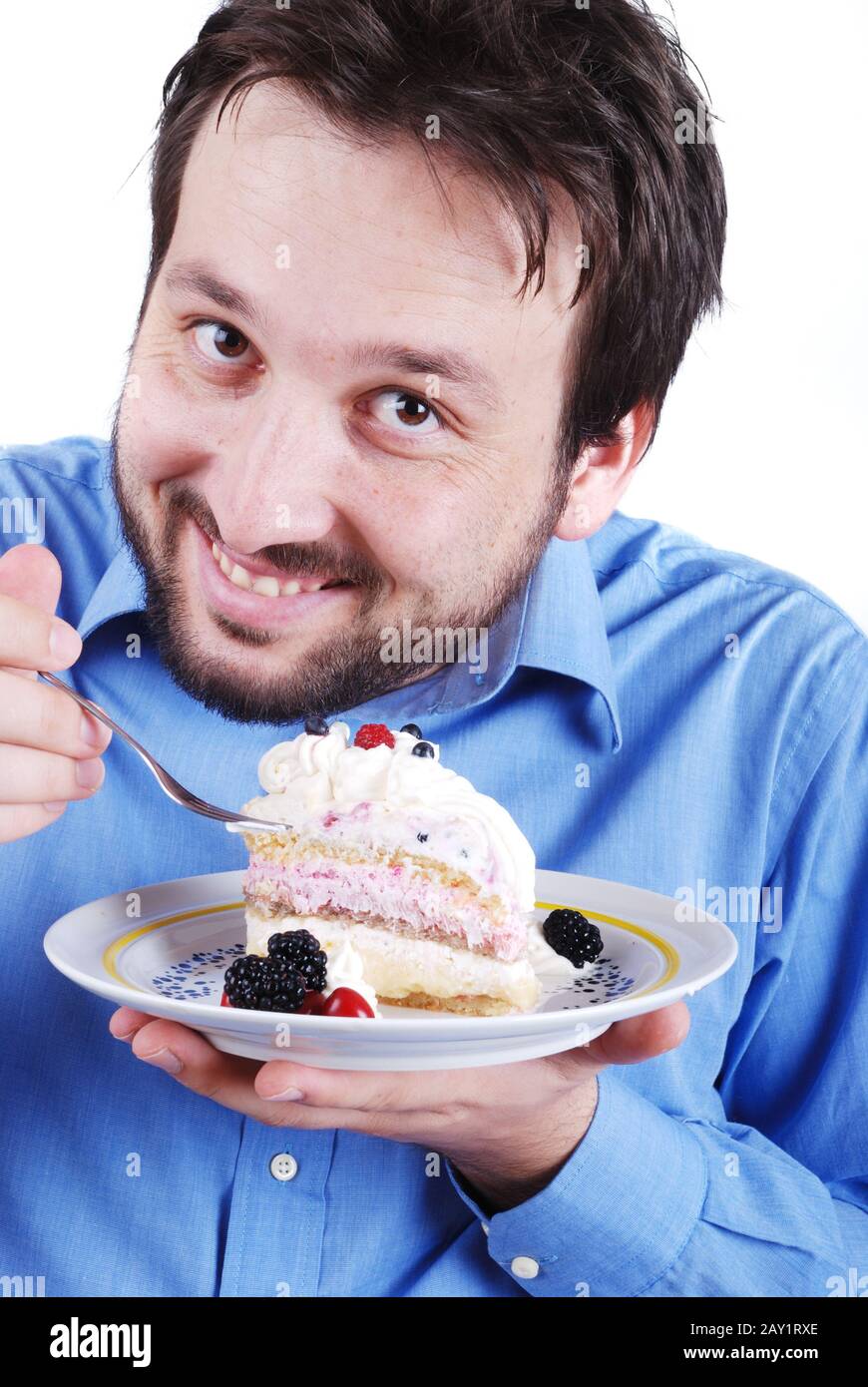 Young man eating cake Stock Photo