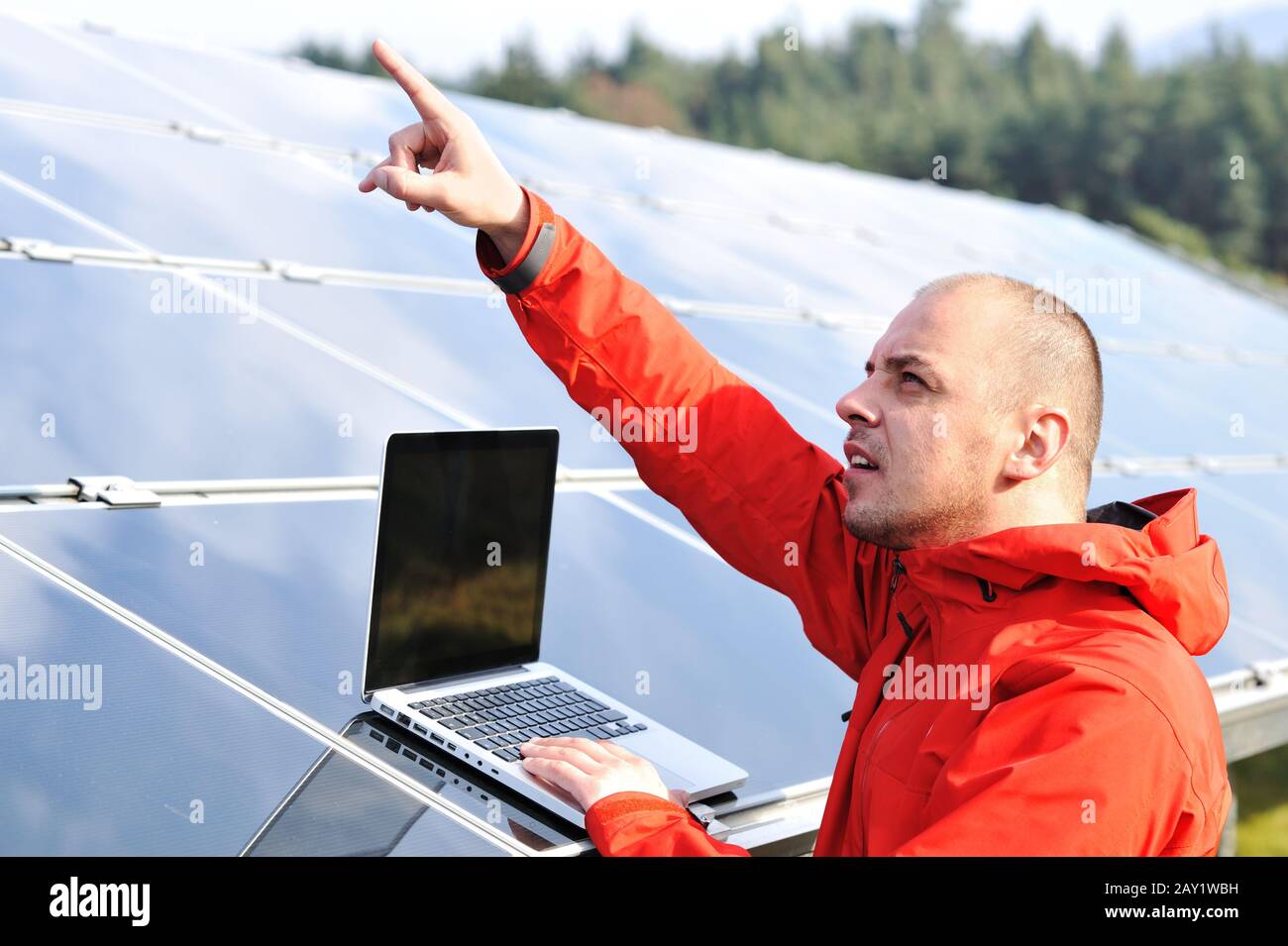 Male engineer using laptop Stock Photo