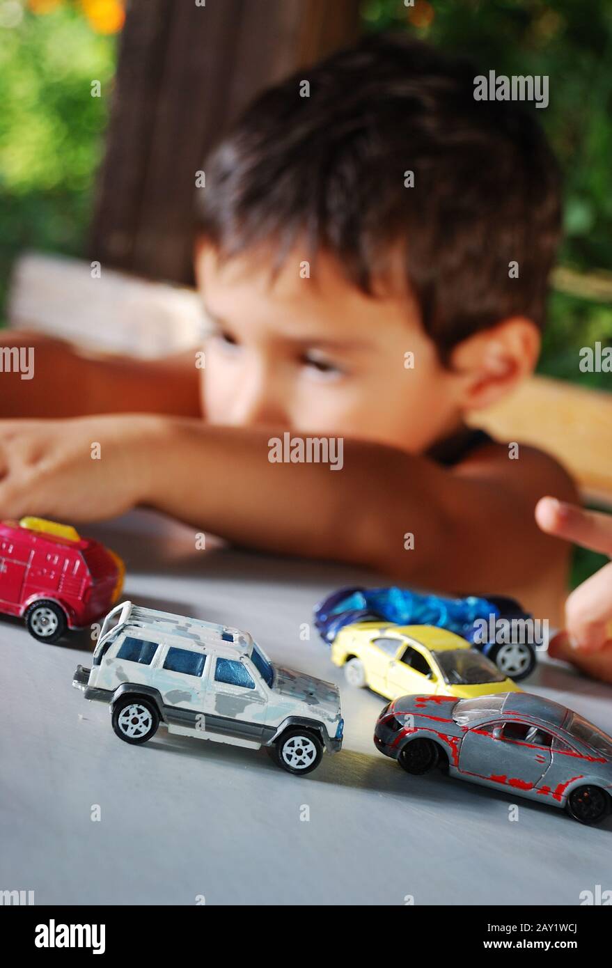 Children playing with cars toys outdoor in summer time Stock Photo Alamy