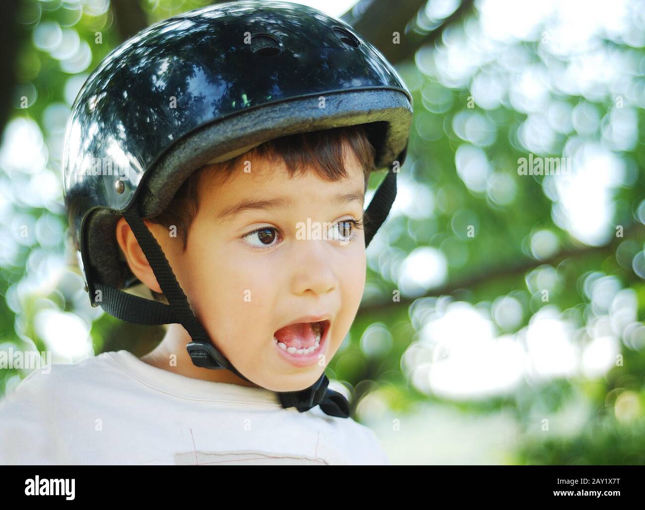 Cute kid with helmet on his head Stock Photo Alamy