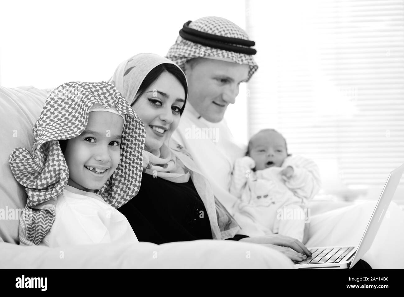 Young family with new baby at home Stock Photo