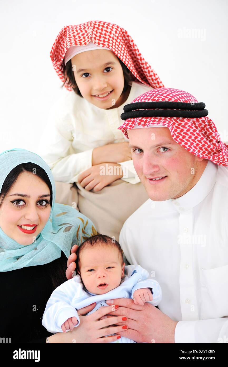 Young family with new baby at home Stock Photo