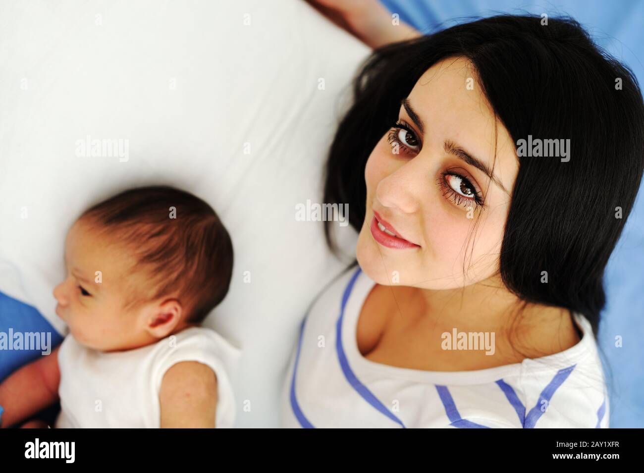 Middle eastern woman with her baby at hospital ro Stock Photo