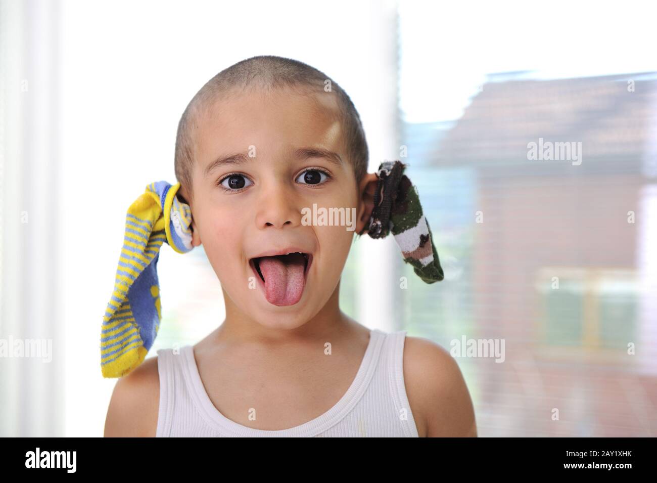 Funny boy with socks on ears Stock Photo Alamy