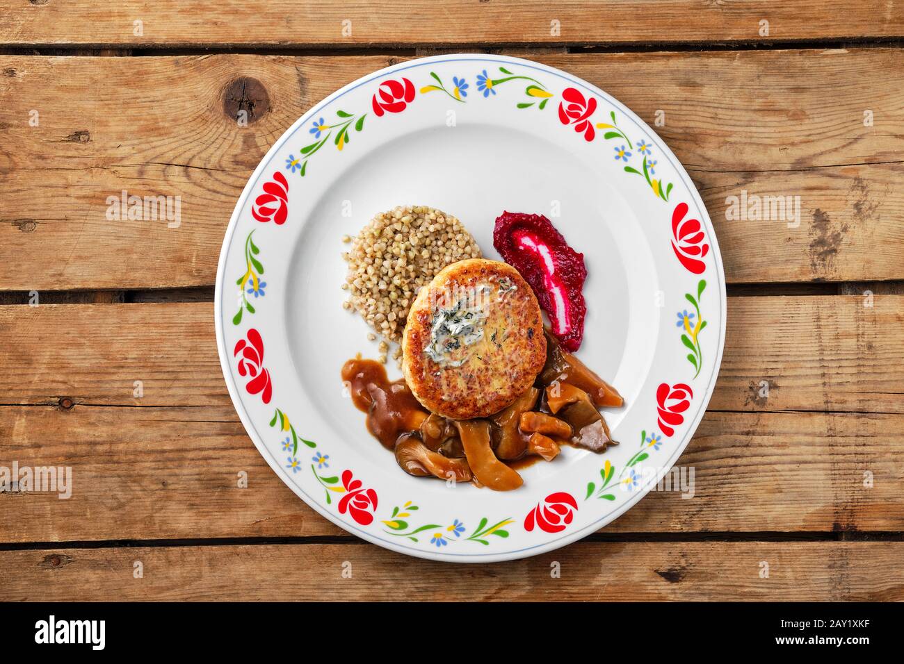 Top view of meat cutlet with honey mushroom and green buckwheat Stock Photo