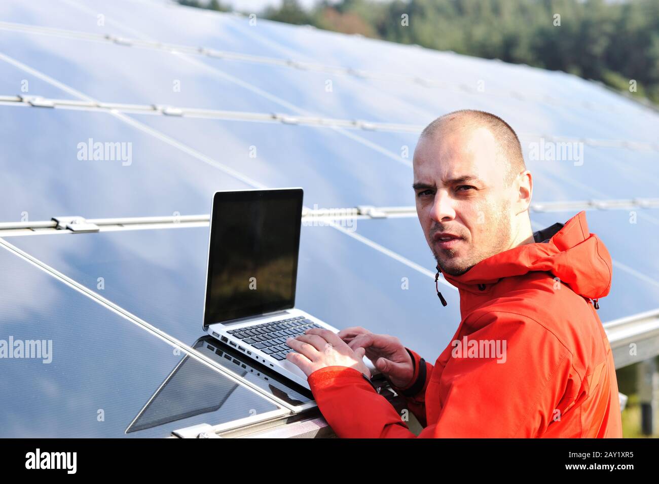 Male engineer using laptop Stock Photo