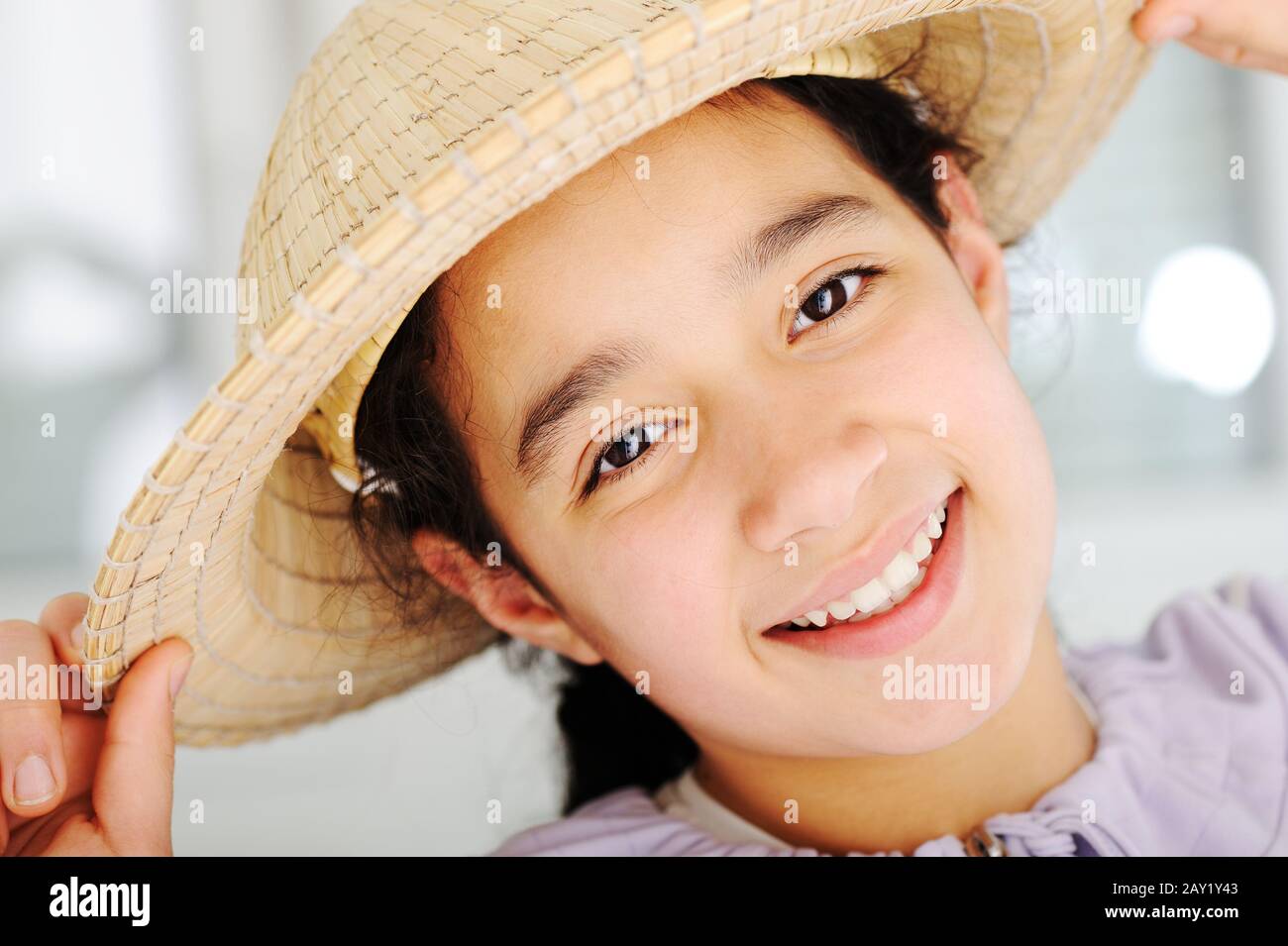 Cute teen girl with straw hat Stock Photo Alamy