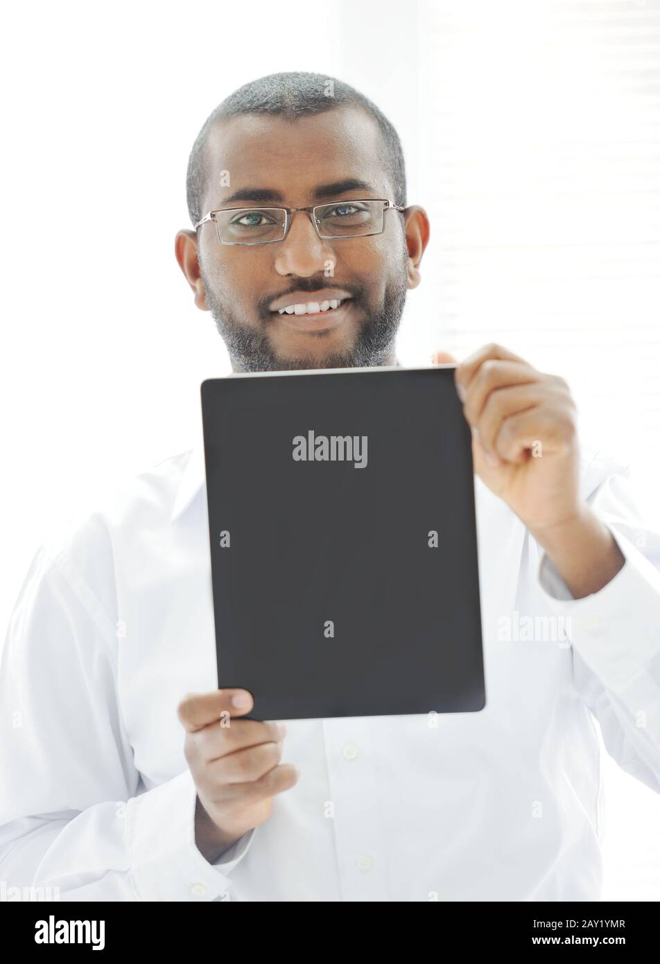 African man holding tablet ready for your message Stock Photo