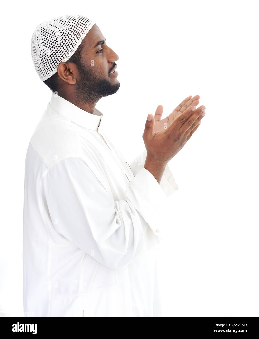 Black arabic man praying Stock Photo