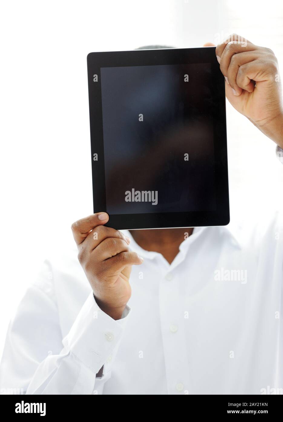 African man holding tablet ready for your message Stock Photo