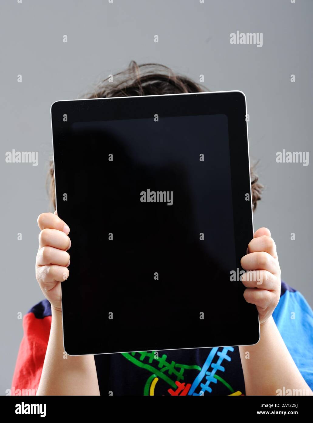 Cute little boy with Tablet PC Stock Photo - Alamy