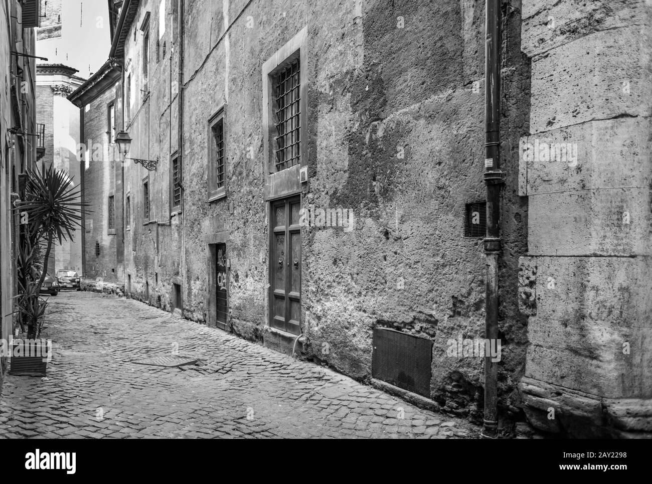 drab monochrome image of back street of Rome Stock Photo