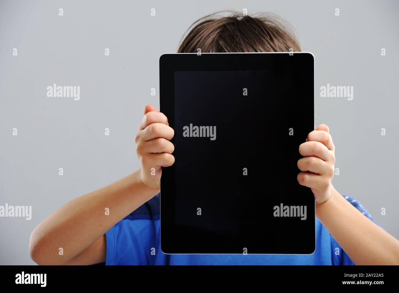Cute little boy with Tablet PC Stock Photo - Alamy