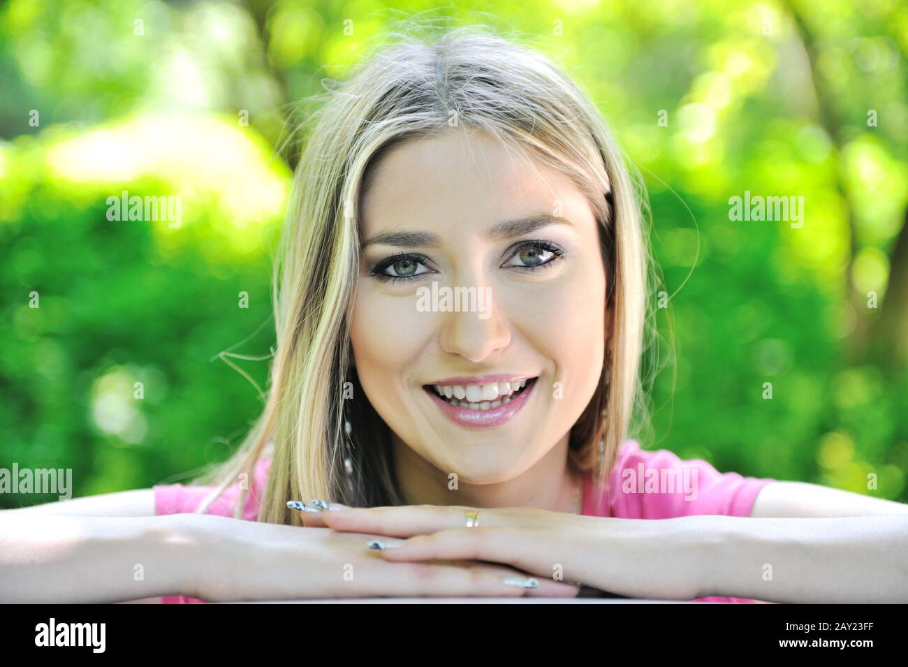Closeup portrait of a beautiful smiling girl outdoors Stock Photo - Alamy