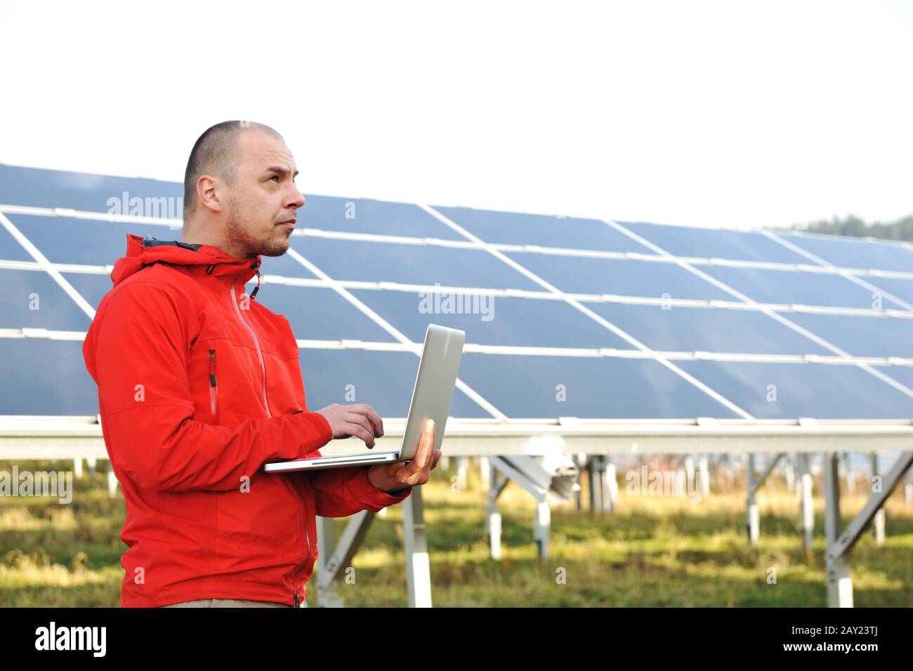 Male engineer using laptop Stock Photo