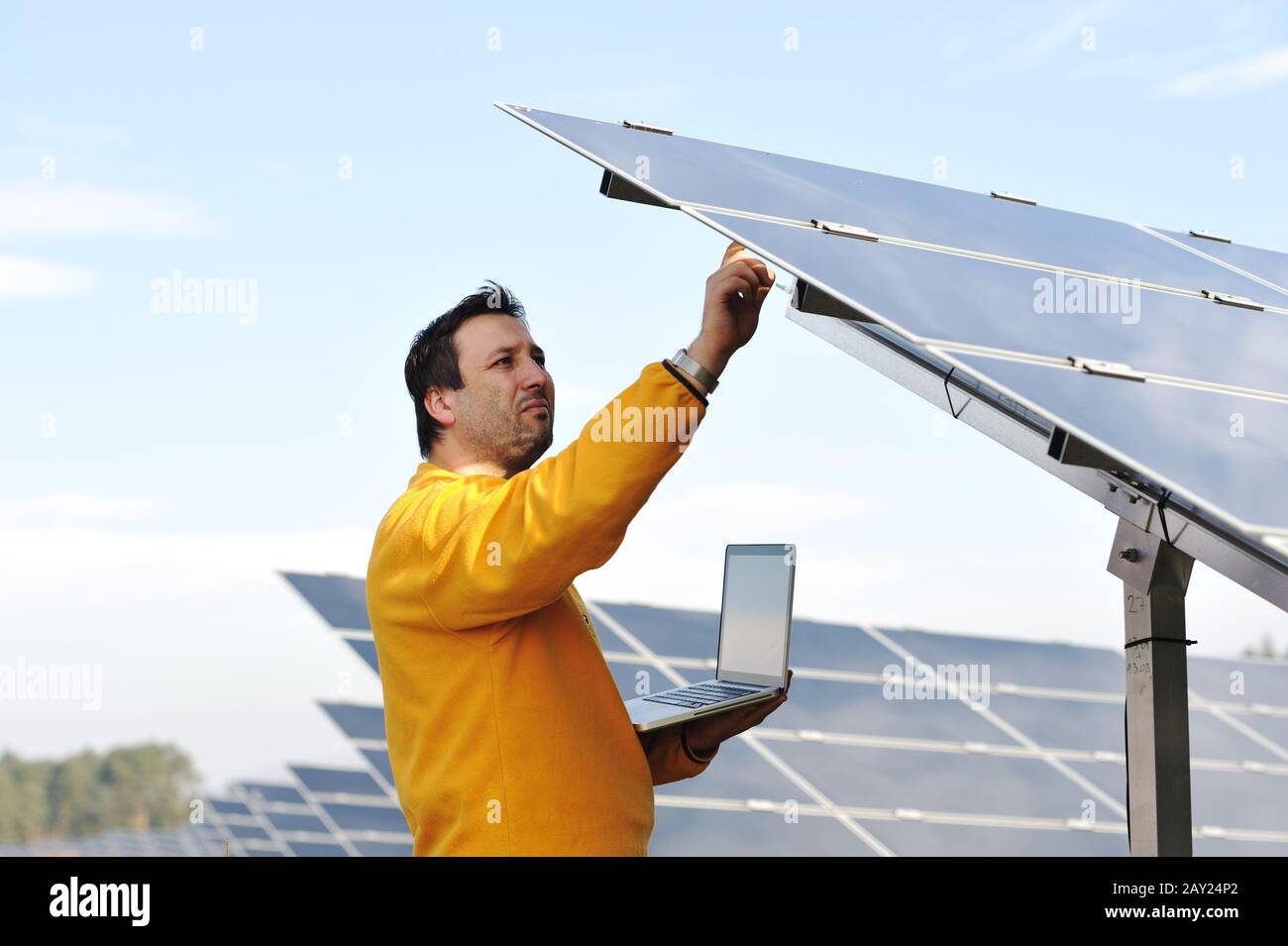 Young expert working at solar panels Stock Photo