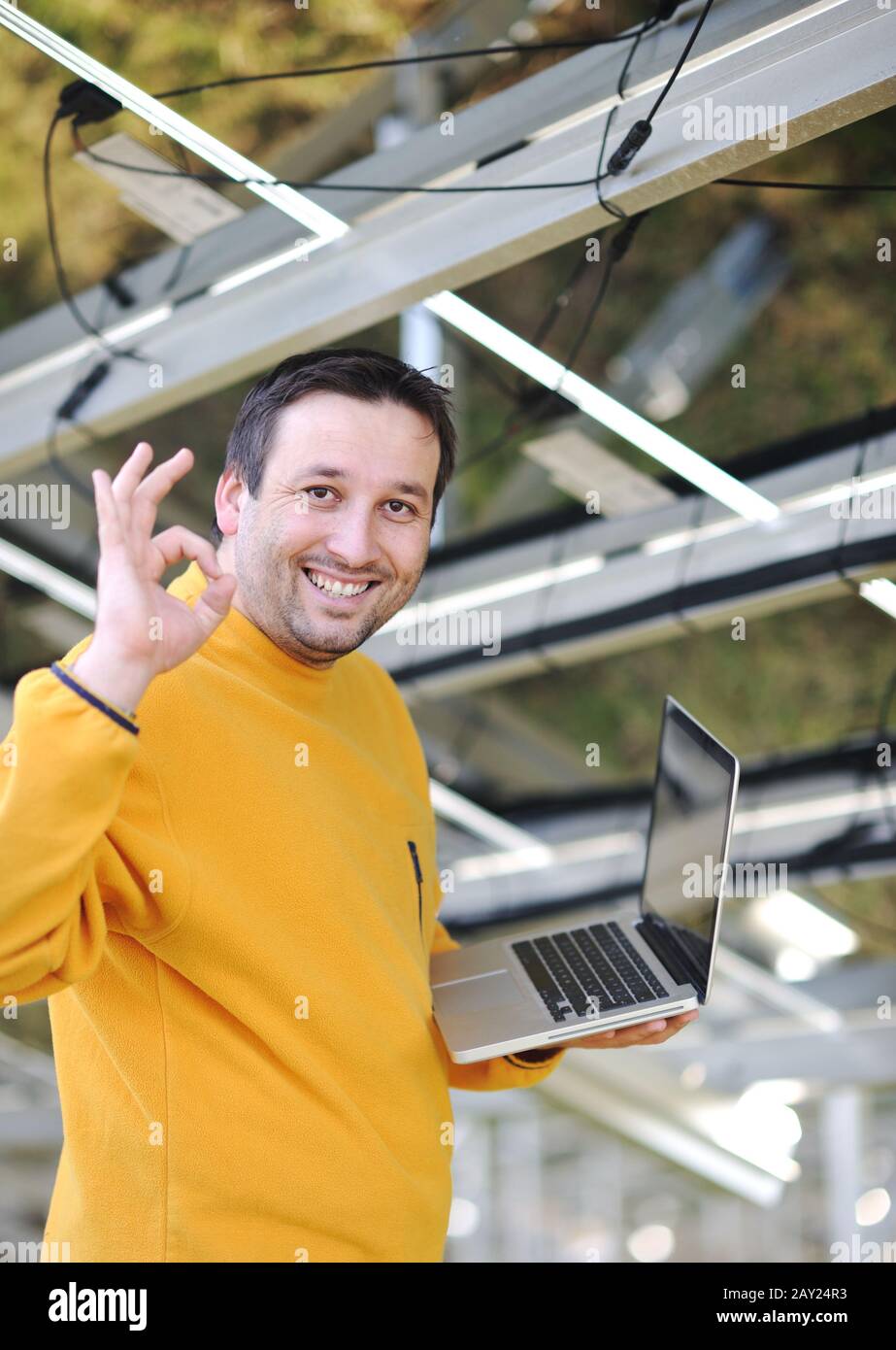 Engineer using laptop at factory Stock Photo