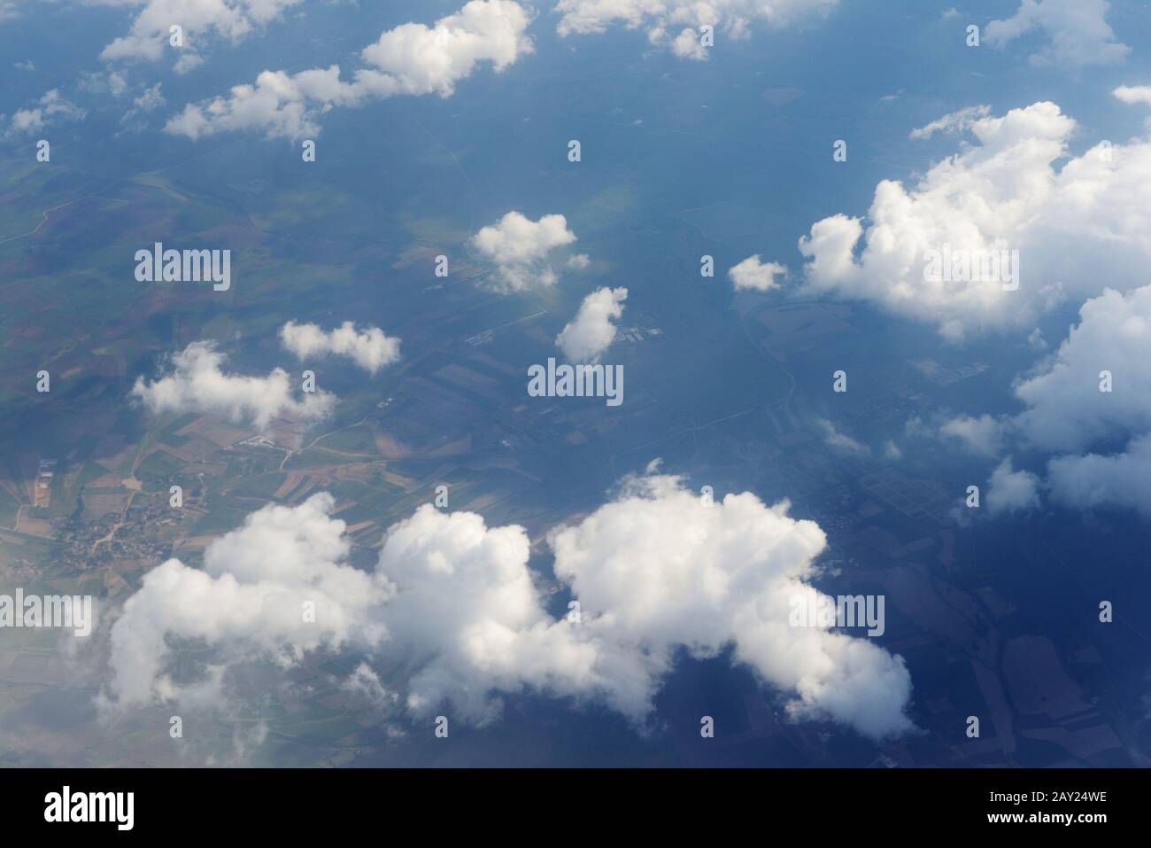 View from airplane window above the clouds Stock Photo