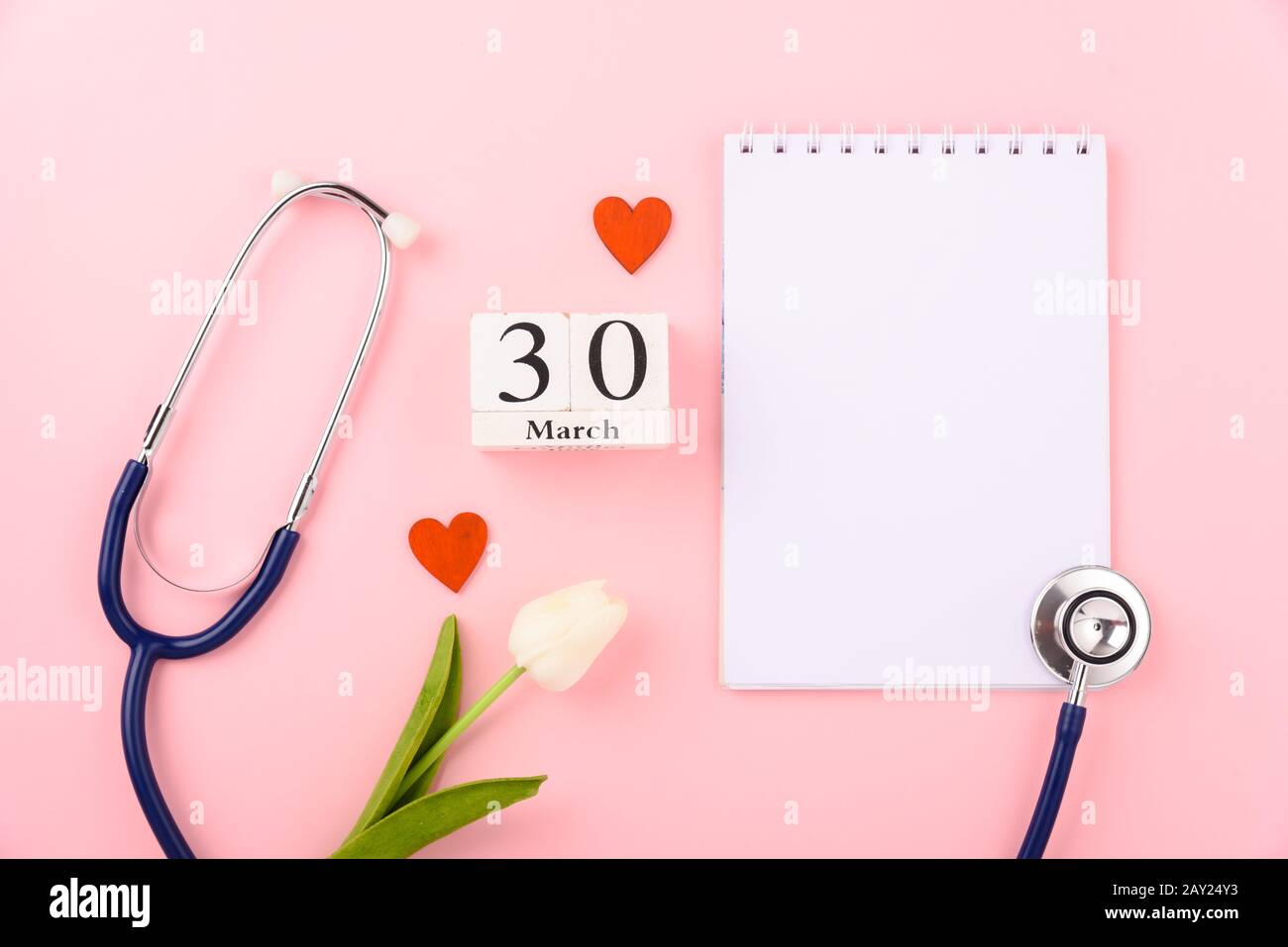 Doctor's Day concept, flat lay top view, equipment medical red heart stethoscope and note book