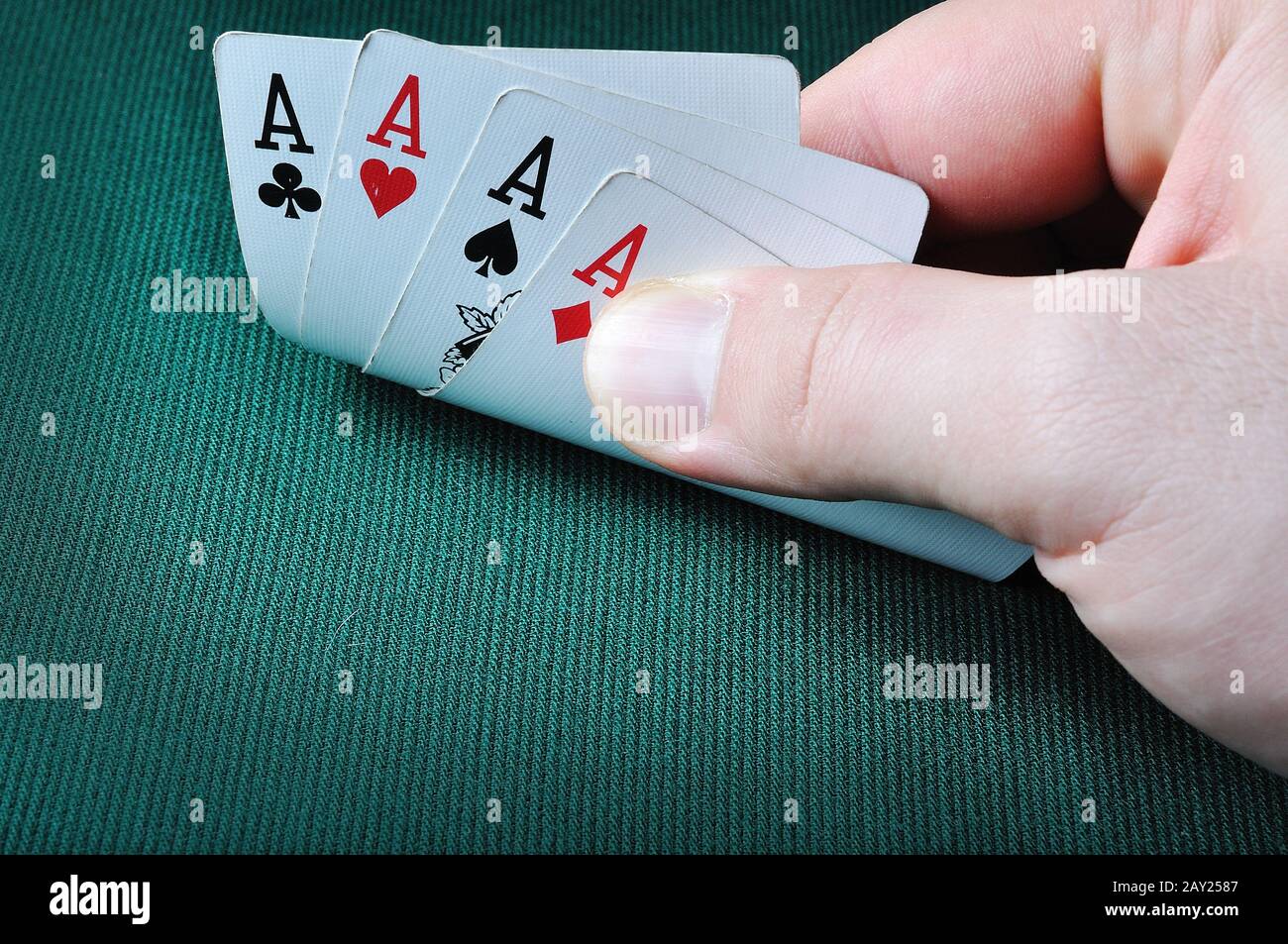 Four Aces In Casino On Green Background Stock Photo - Alamy