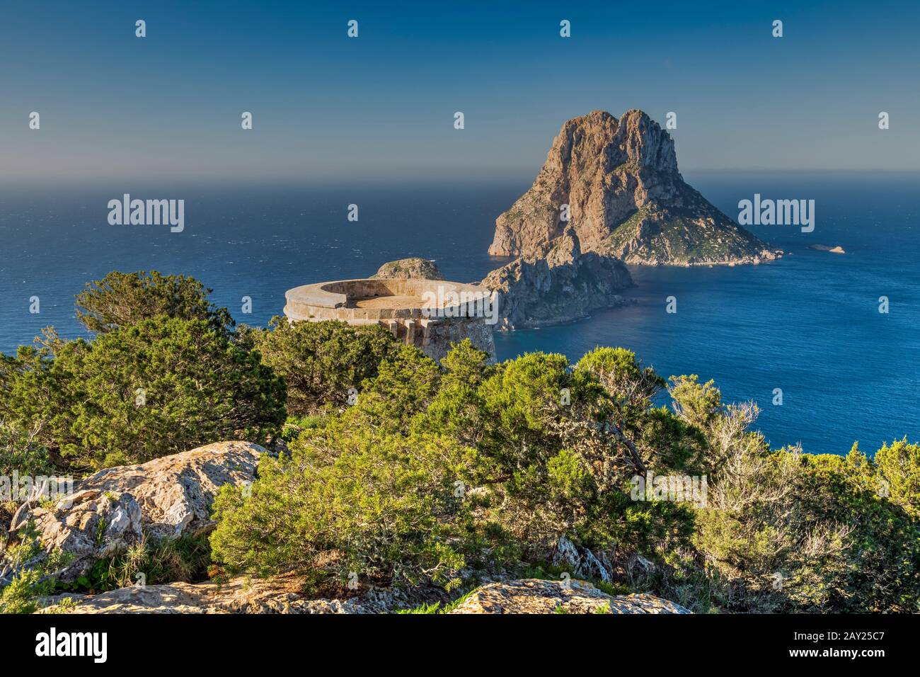 Torre des Savinar defence tower with Es Vedra island in the background, Ibiza, Balearic Islands, Spain Stock Photo