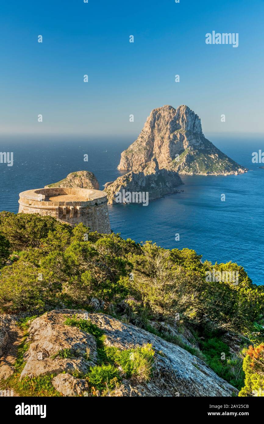 Torre des Savinar defence tower with Es Vedra island in the background, Ibiza, Balearic Islands, Spain Stock Photo