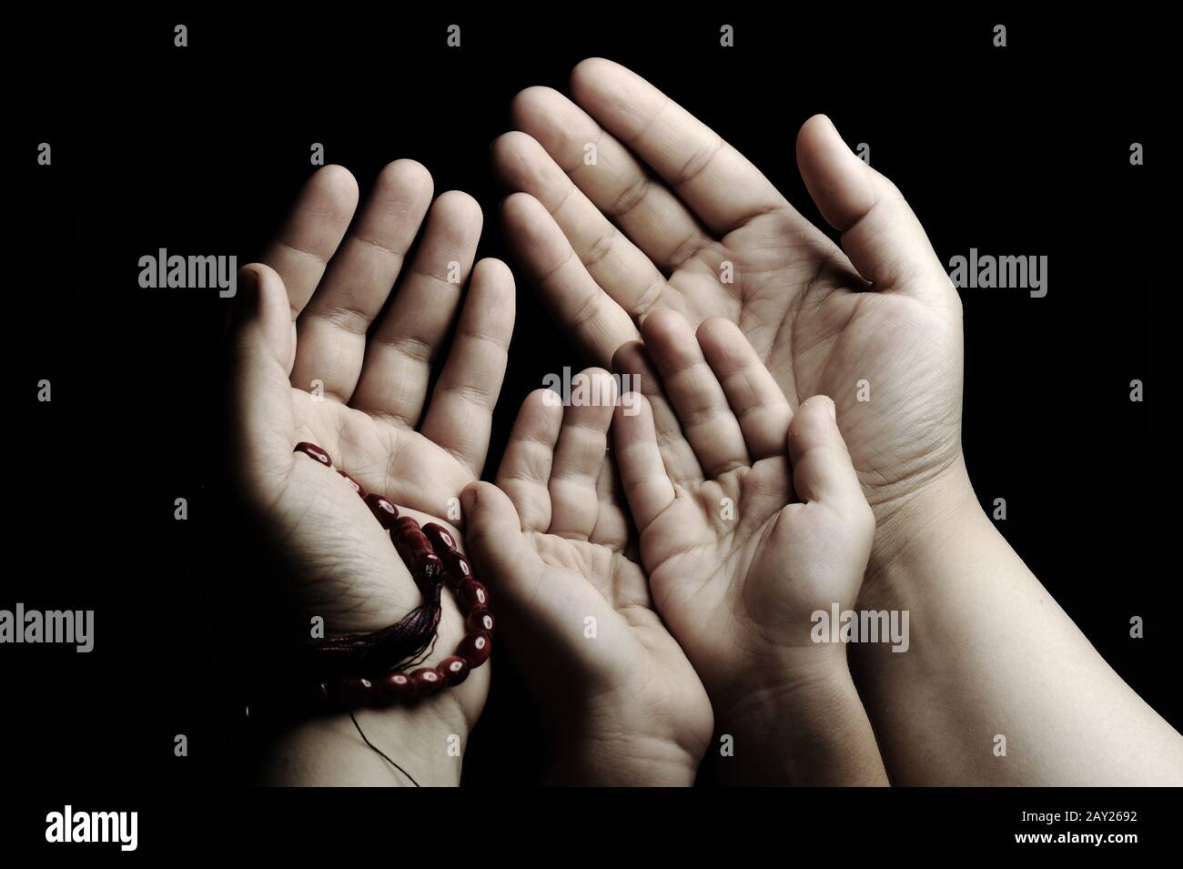 Adult child praying together hi-res stock photography and images - Alamy
