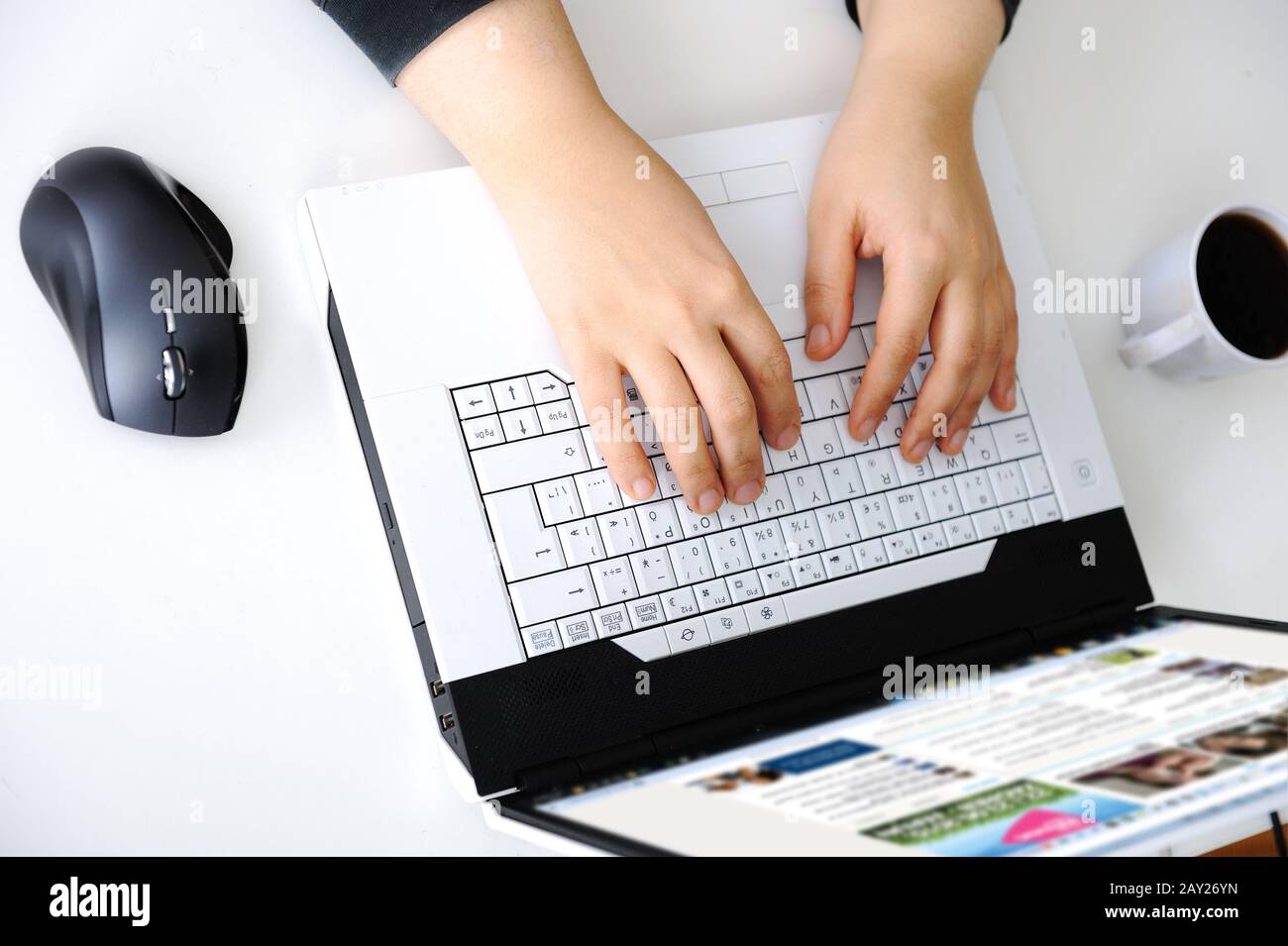 Hands on notebook Stock Photo