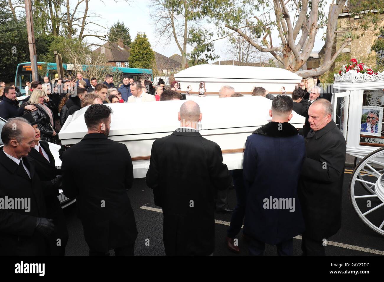 The coffins of Billy (bottom) and Joe are carried into St John the(02)