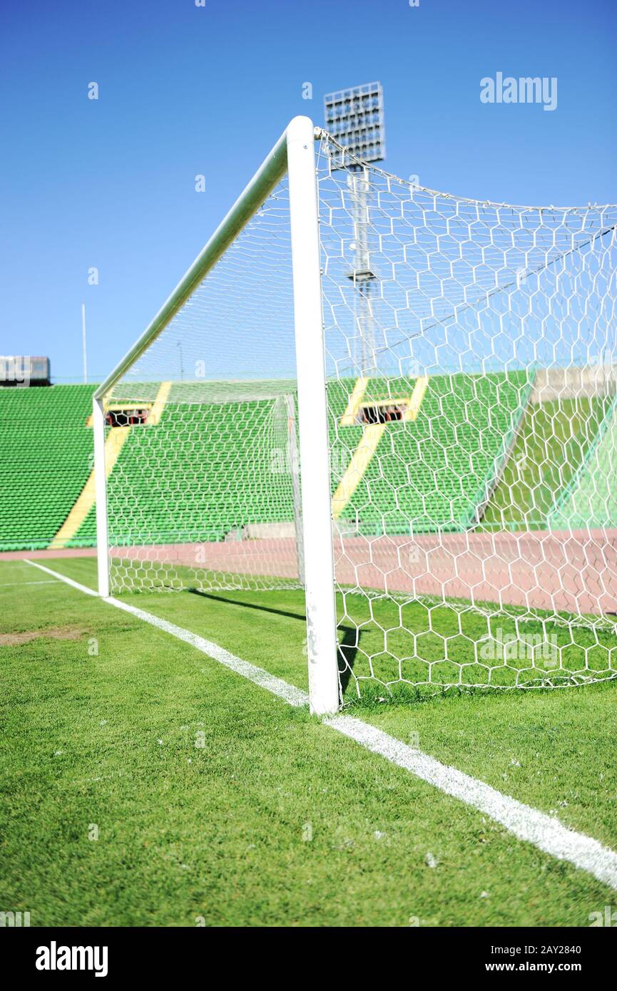 goal net and white line in a soccer field on stadium Stock Photo