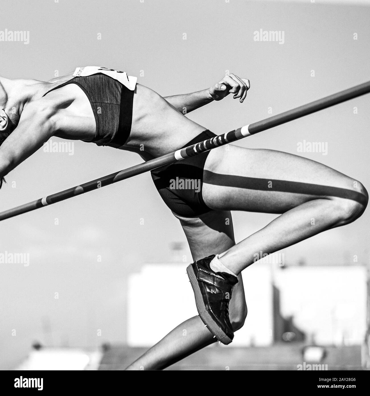 high jump in athletics women athlete black and white image Stock Photo