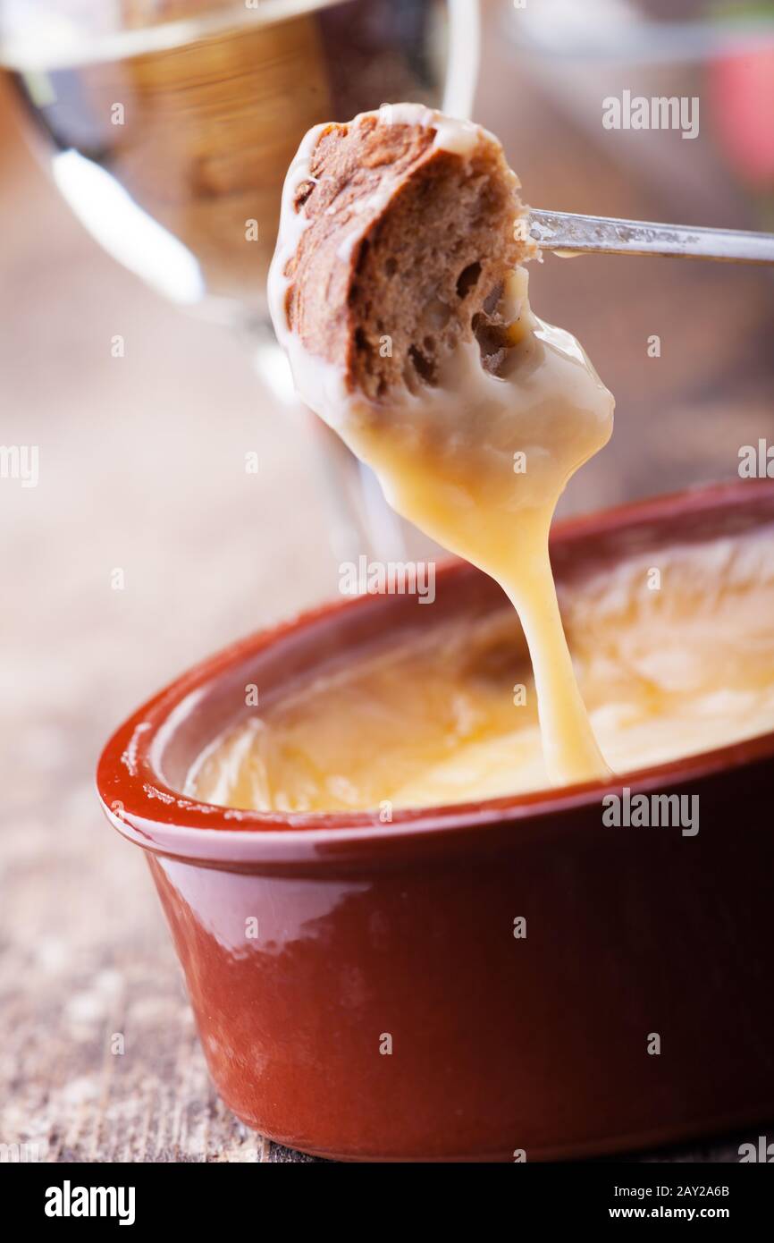 Bread and cheese fondue Stock Photo Alamy