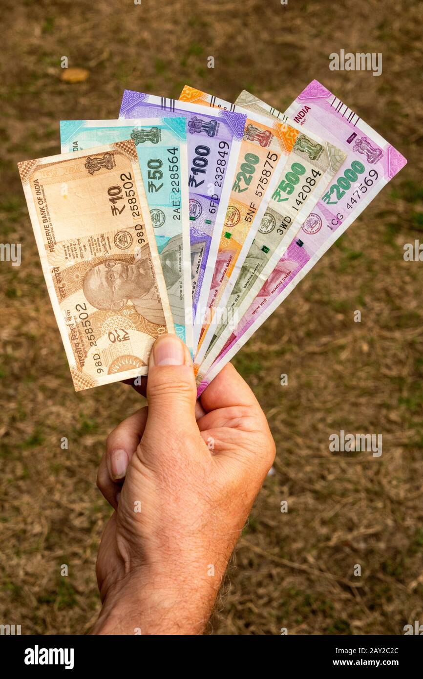 India, hand holding all 2020 Indian currency Rupee Banknotes Stock Photo