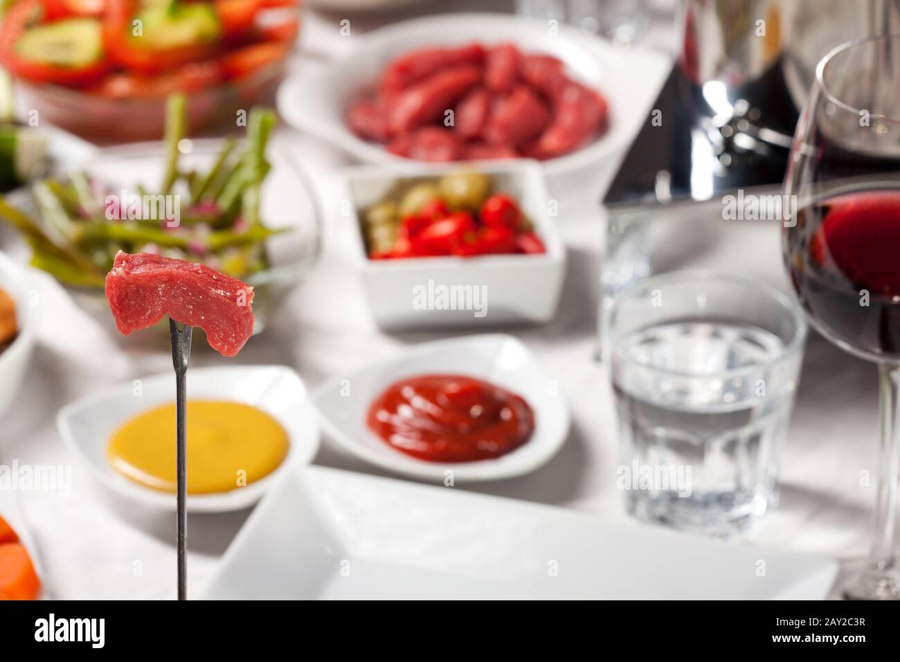 Fondue and red wine Stock Photo Alamy