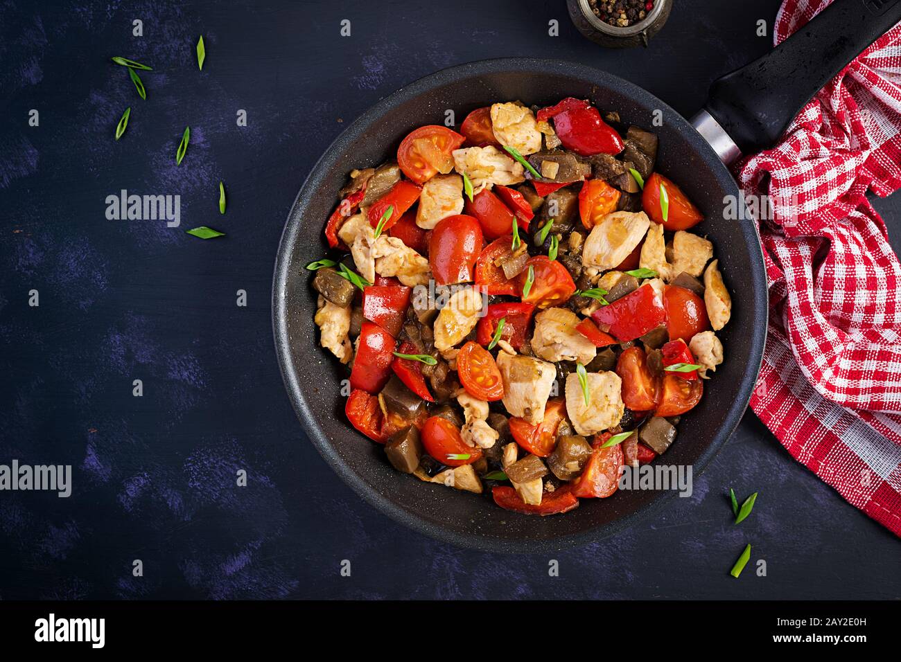 Chicken stir fry. Meat stew with vegetables sweet pepper, onion, tomato