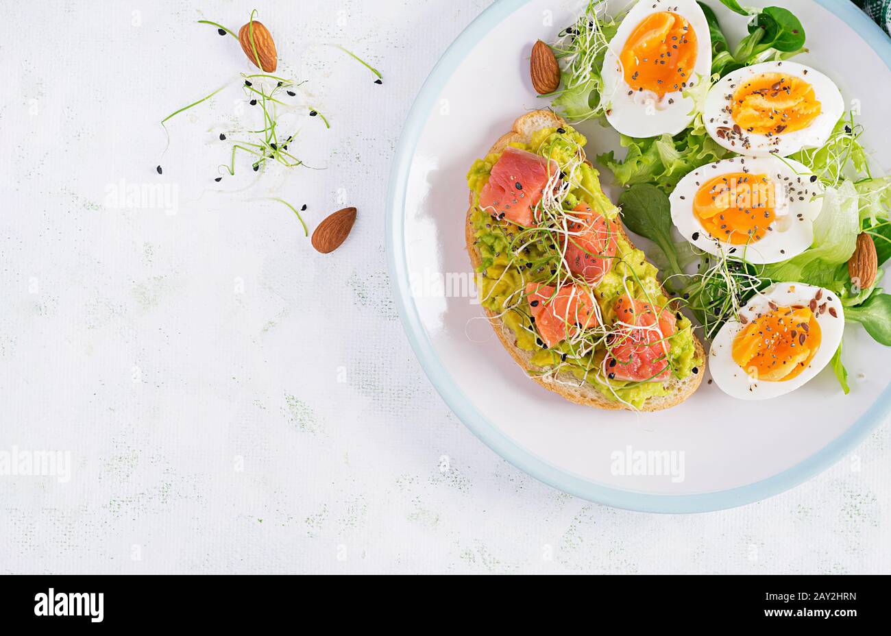 Breakfast. Healthy open sandwich on toast with avocado and salmon