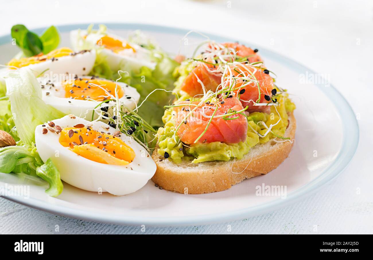Breakfast. Healthy open sandwich on toast with avocado and salmon