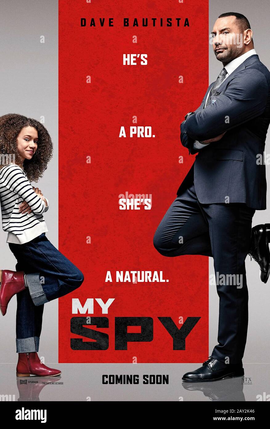 My Spy (2020) directed by Peter Segal and starring Dave Bautista, Chloe Coleman and Parisa Fitz-Henley. An undercover CIA agent is made by a 9 year old girl in the family he is surveiling. Stock Photo