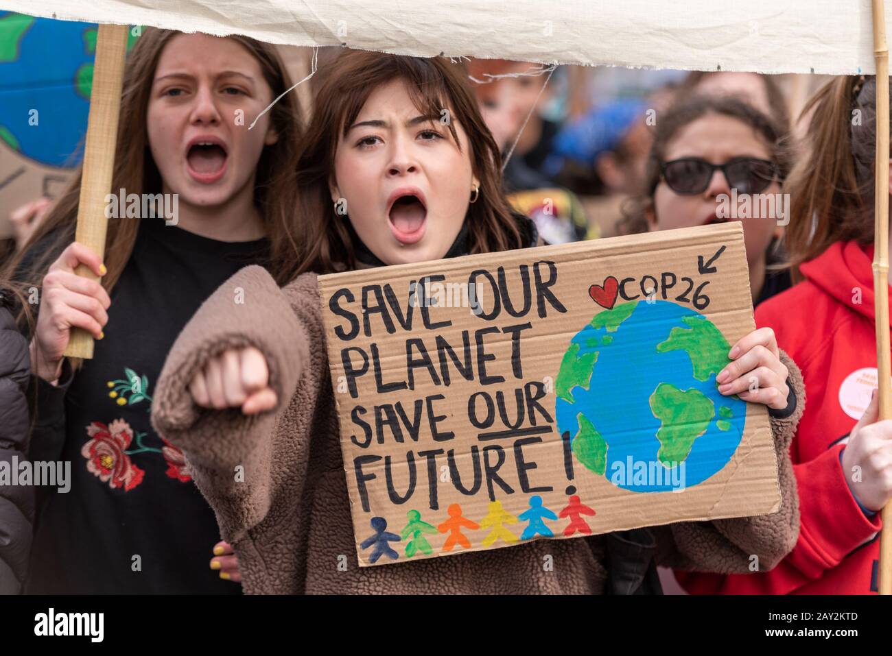 Parliament Square, London, UK. 14th Feb, 2020. One year after the first UK youth climate strike youngsters are again protesting to demand climate action. They believe that governments are not acting fast enough to reverse the damage to the climate. Many skipped their education to attend Stock Photo